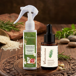 Vrishvrindaa Rosemary and Rice Water Hair Mist with Rosemary Essential Oil displayed with fresh rosemary on a wooden surface.